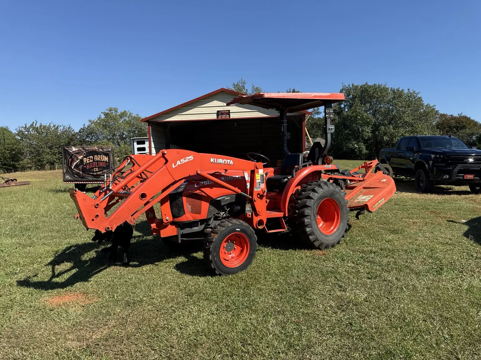 Red Drum Kubota compact tractor ready for property work