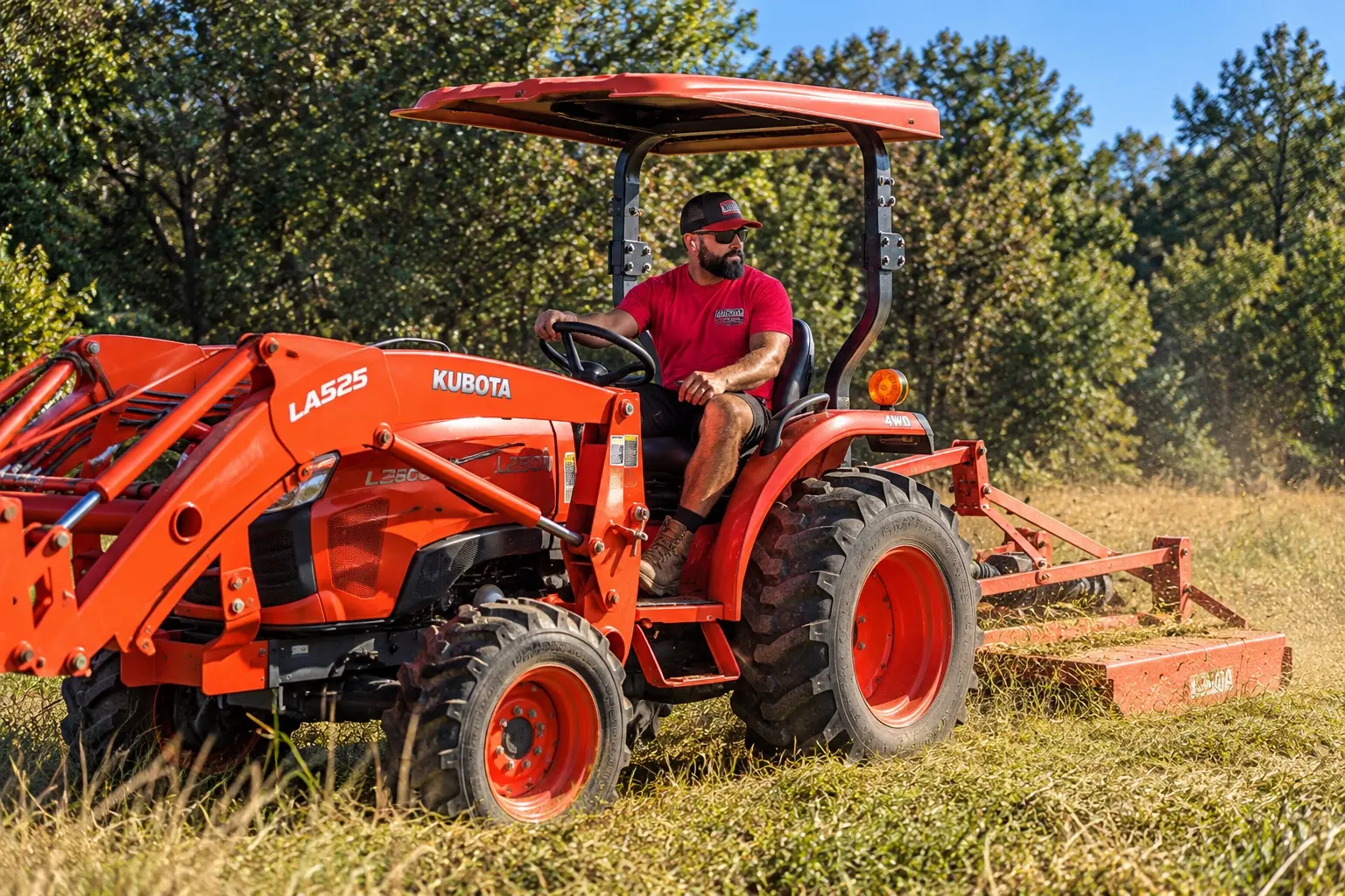 Kubota tractor working in tall field growth